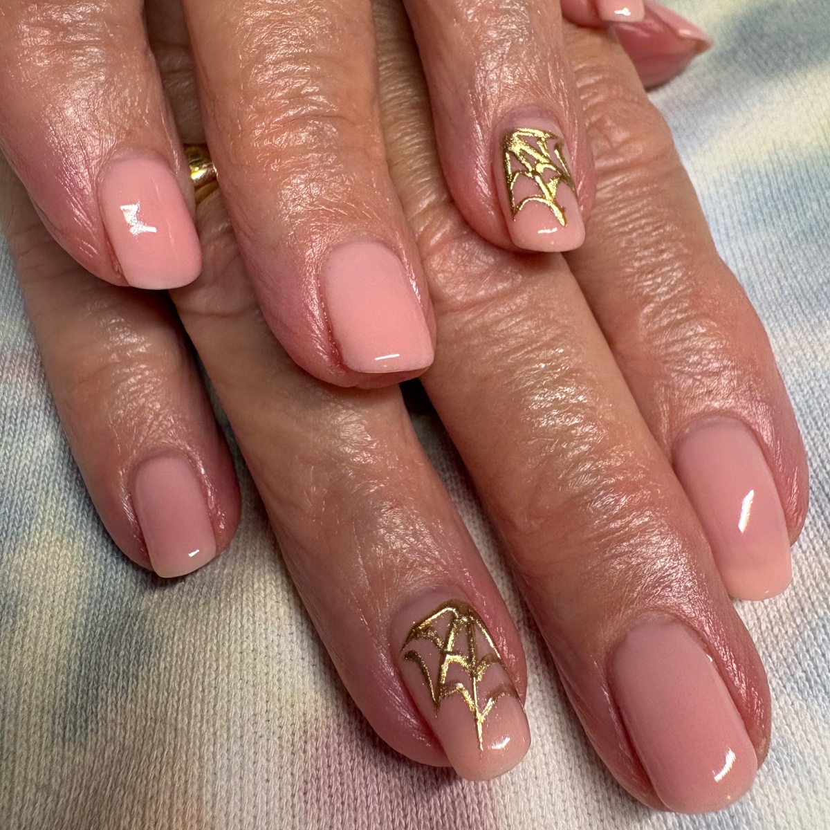 Pink ombre nails with hand-painted leaves